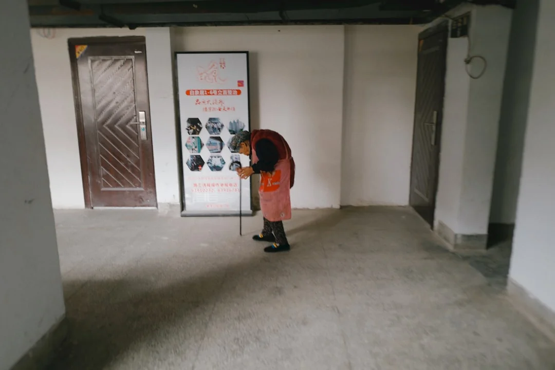 Cleaner cleaning the floor in a laboratory environment